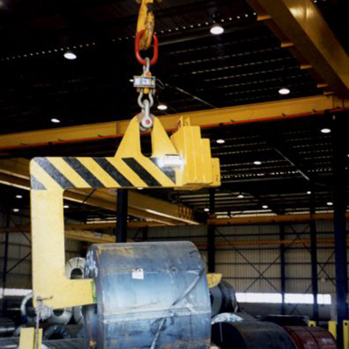 A metal coil is lifted and weighed